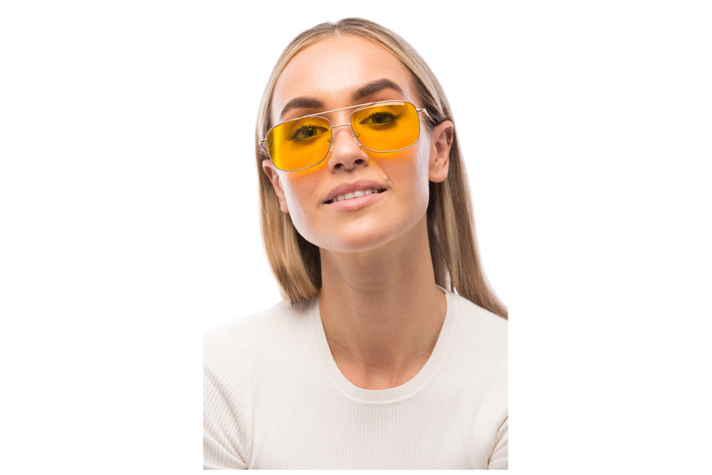 Woman Wearing Magnum Light Sensitivity Glasses Readers