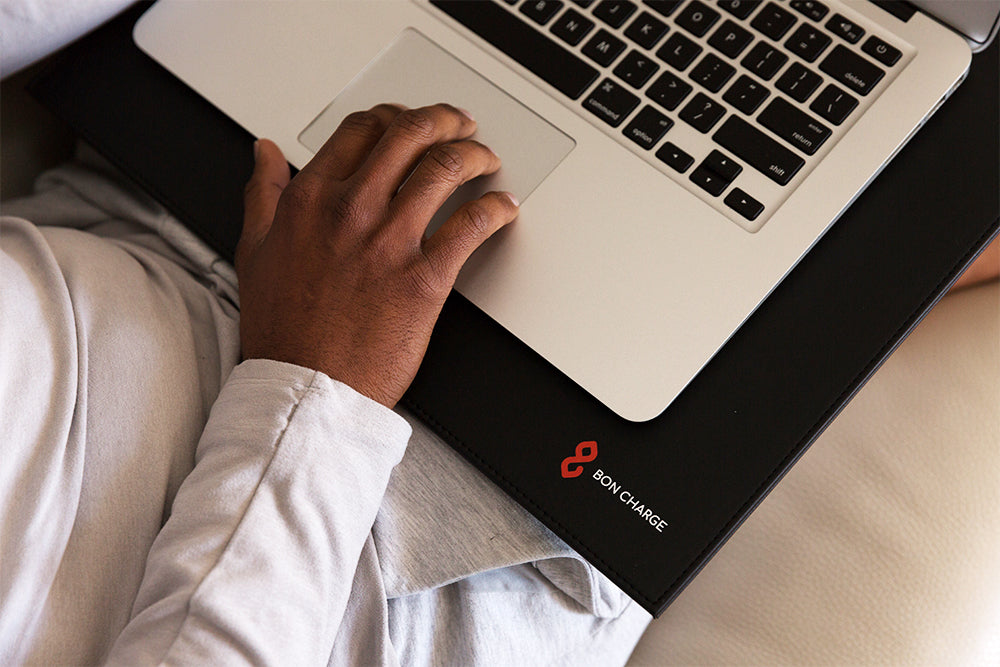 Man Using EMF Radiation Blocking Laptop Mat Under Computer