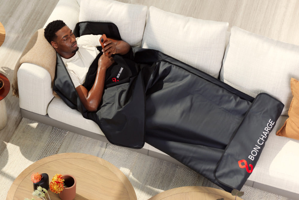 Man Using Infrared Sauna Blanket